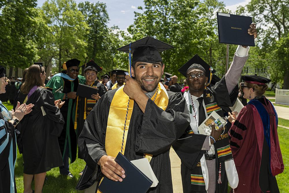 Jose Elias Guillen II'24 walks past excited crowds after the ceremony.