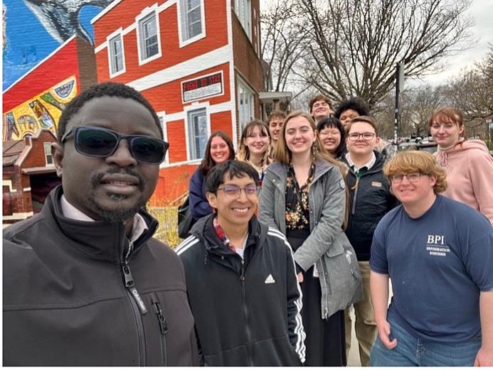 Dr. Gana Ndiaye and Logan Museum Assistant Curator Leeann Ream with ANTH 275 Global Cities students.